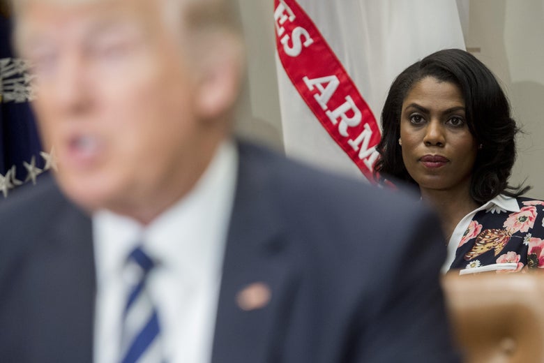 Omarosa Manigault sits behind President Donald Trump as he speaks during a meeting with teachers, school administrators and parents in the Roosevelt Room of the White House in Washington, D.C. on February 14, 2017.